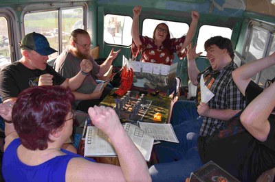 RPG Bus gamers playing Tabletop Role-Playing Game Players, Cheering in an Adventures in Middle-earth RPG session